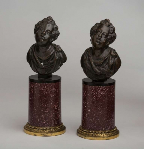 A Pair of Italian Baroque Patinated Bronze Putti with Porphyry Bases